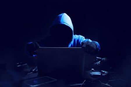 Hacker man terrorist with virus computer attack to server
