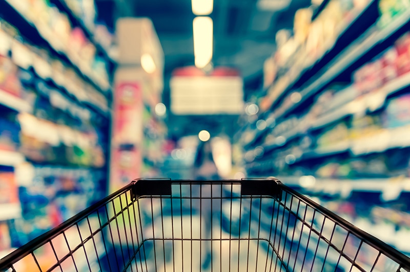 Abstract blurred photo of store with trolley