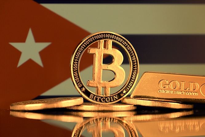 Physical version of Bitcoin, gold bar and Cuba Flag.
