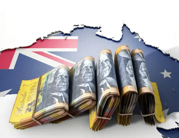 money in rubber bands on the background of the Australia flag
