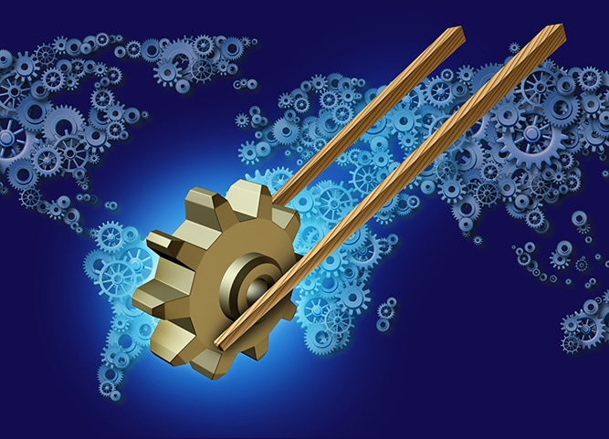 Asia export business concept for global trade as a pair of wooden chopsticks transporting a three dimensional gear or cog industry icon on a group of gears and cogs shaped as a world map for Asian global partners.