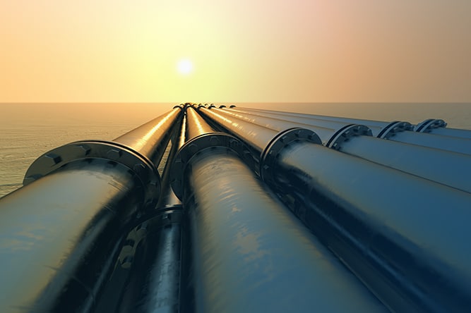 Tubes running in the direction of the setting sun. Pipeline transportation is most common way of transporting goods such as Oil, natural gas or water on long distances