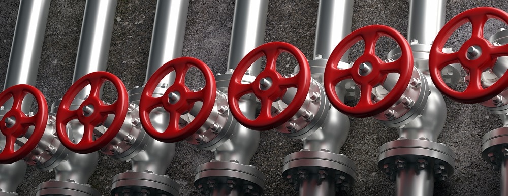 gas industry. Pipelines and valves with red wheels system on gray wall background, banner. 3d illustration