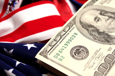 American flag and dollars