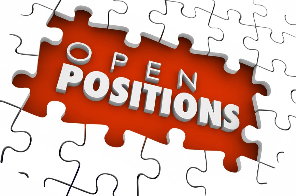 Open Positions words in a puzzle hole as a need to find job candidates for unfilled worker or staff employee slots