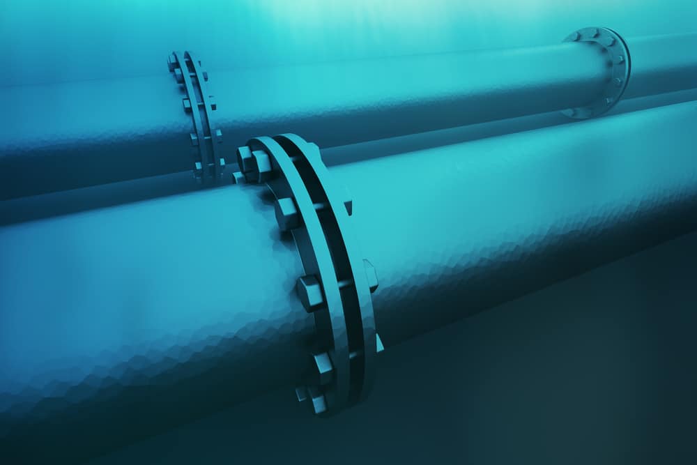 Closeup on details of an underwater pipeline. Pipeline transportation is most common way of transporting goods such as oil, natural gas on long distances.