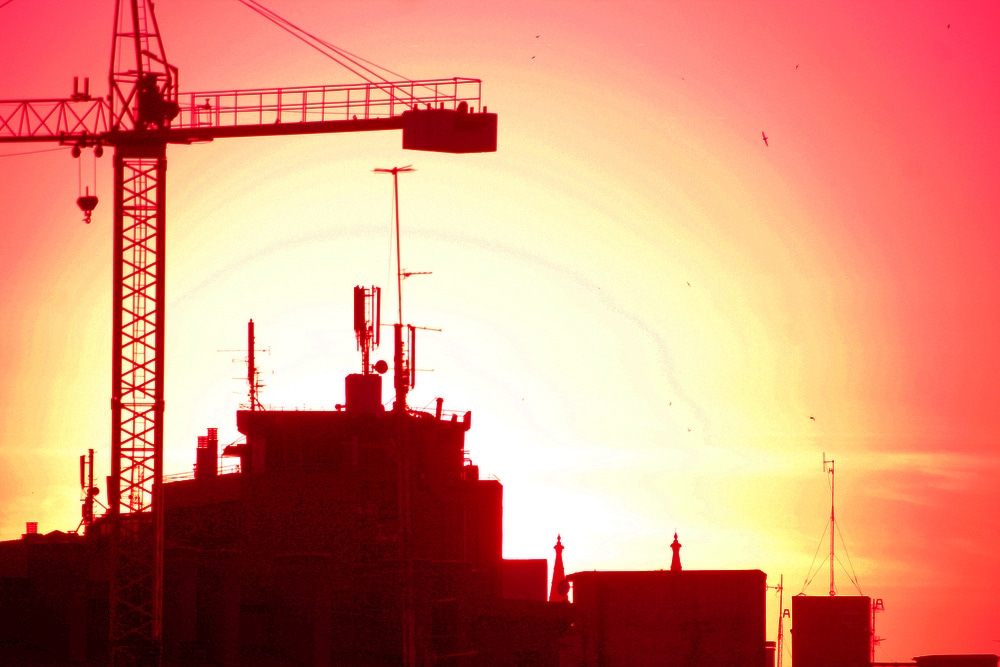 Construction crane silhouette in the evening