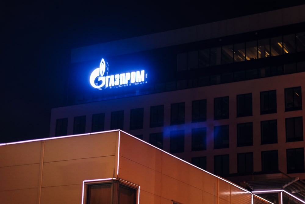 Gazprom building with logo glows at night saint petersburg company