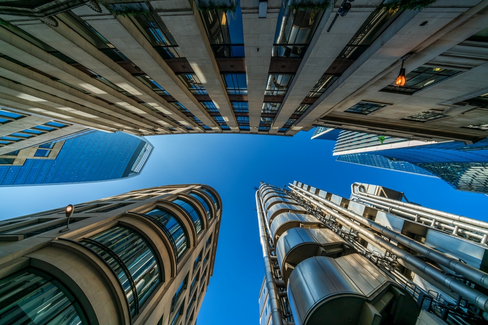 LONDON, UK - FEBRUARY 23, 2019: Upward view of modern skyscrapers in the City of London, the heart of financial district in London. Over 300,000 people work there, mainly in the financial services sector
