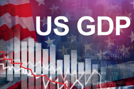 Slow down production in US. Drop in economy in US during crisis. US GDP logo next to graph down. Crisis in US banking system. Concept stock market panic led to a decrease in GDP. Financial recession
