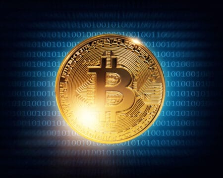 Gold bitcoin on a wdark blue background