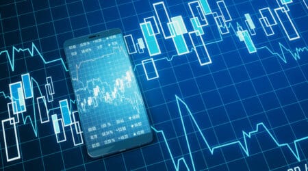 Modern close up image of cellphone with creative forex chart on blue background. Trade, finance, technology and communication concept. 3D Rendering